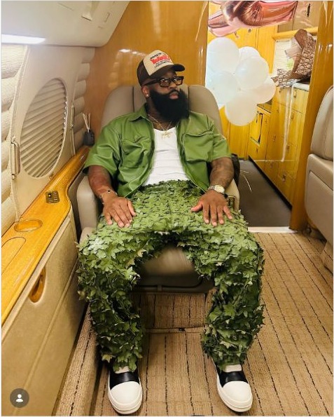 TC Cooper seated aboard a private jet